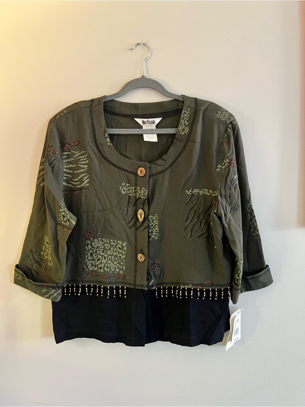 Nina Piccalino Olive Green and Black Jacket Label